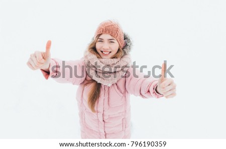 Young positive girl shows gesture hands, super, class, winter morning, happy beautiful, the picture for advertising, insert text