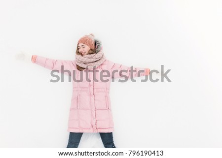 Young positive girl on white isolated background, snow field, winter morning, happy beautiful, the picture for the ad, insert text