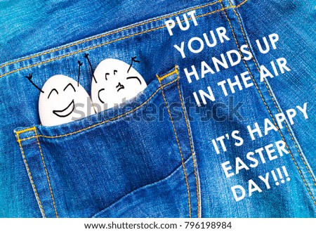 funny eggs celebrate in the pocket of a blue jeans with text put your hands up in the air it's happy easter day!!!