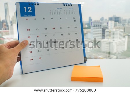 close up woman plan meeting and vacation on mock up December calendar