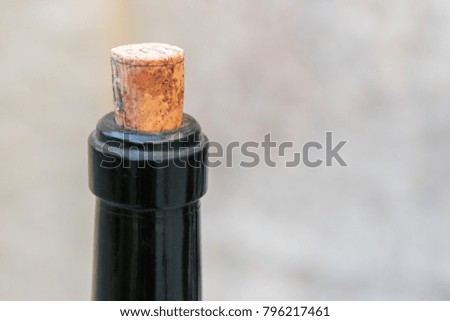 Neck of a wine bottle with cork; close-up