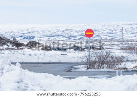 Beautiful View and winter Landscape picture in Thingvellir National park, Iceland in the winter, covered by snow.  Focus on stop sign.
