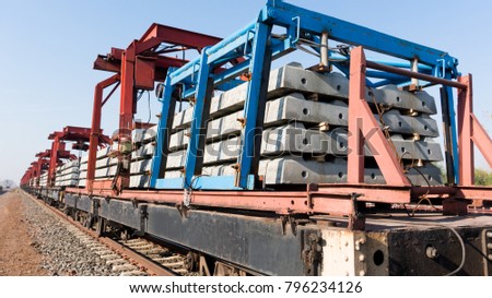 the cargo train carrying the concrete rail sleeper for the new double track railway construction project in Thailand