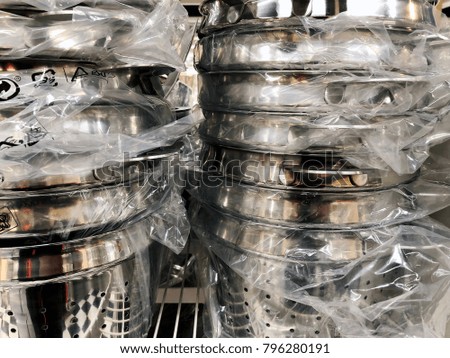  Stainless steel of kitchen ware stack for sale in the market. Closeup