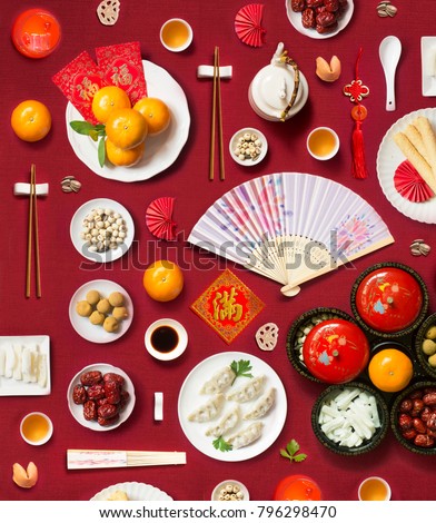 Text appear in image: Prosperity, Wealth. Flay lay Chinese new year food and drink, related objects on red background. Royalty-Free Stock Photo #796298470