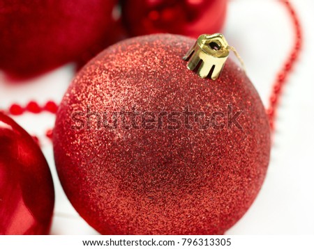 three red christmas balls isolated on white background