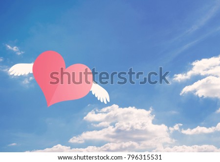 Pink paper heart flying on blue sky background, valentine day, romantic and falling in love concept