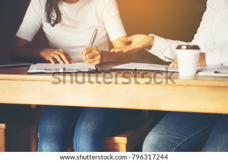 Business woman signing contract