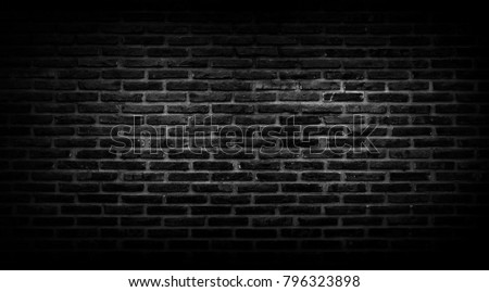 Old brick wall background in black Or black wall surface using a large number of bricks. Put together beautifully the background.