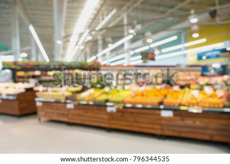 Supermarket grocery store with fruit and vegetable on shelves blurred background