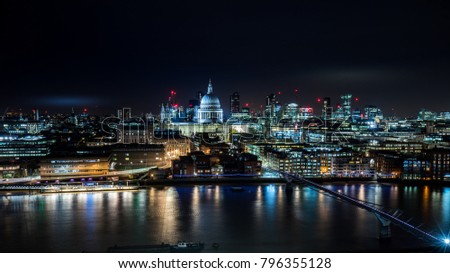 View on St. Paul's Cathedral, river Thames, Millennium bridge and City if London. Night shot.