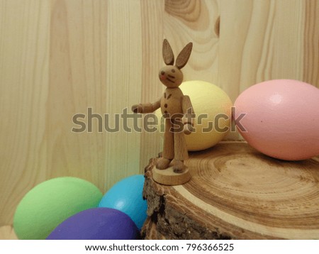 Easter bunny & Eater eggs with wooden surroundings