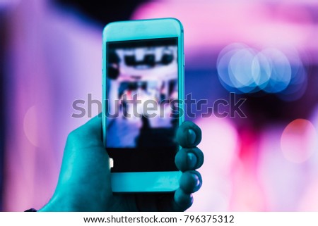 taking a photo with a smartphone at the club