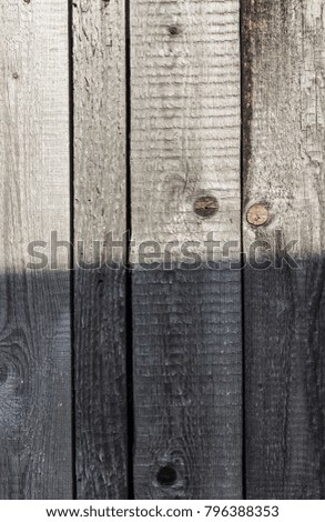 Grey board fence in sunny comfort weather