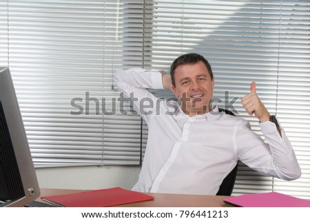 Man or businessman at office work happy