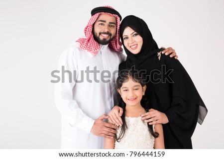 Arab family standing on white background