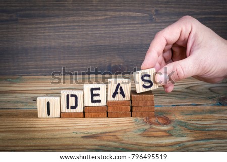 ideas. Wooden letters on the office desk, informative and communication background