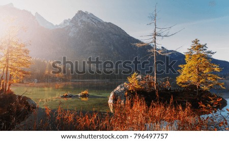landscape on Alpine highland. Overcast clouds, under sunlight of sunset on Famous lake Hintersee. Popular photography locations. Wonderful Travels places. amazing view of rocks hill in sunny mountains