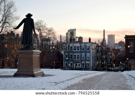 View of Boston, MA skyline from the Bunker Hill Monument grounds at sunset