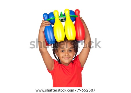 African little girl with with a bowling game on his head isolated on a over white