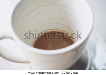 the layer of coffee stains on a cup of coffee in blurred style for background