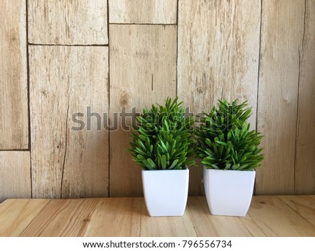 tree Wood table top and blurred flowers background with vintage filter Royalty-Free Stock Photo #796556734