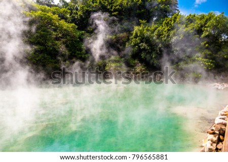 The jade-like hot spring at Beitou Thermal Valley is releasing sulphuric steam. The Geothermal Valley has a temperature between 80 to 100 degrees Celsius and is famous for the rare hokutolite rocks. Royalty-Free Stock Photo #796565881