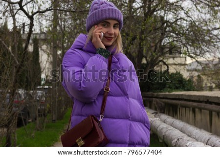 Young pretty girl with smartphone, outdoor