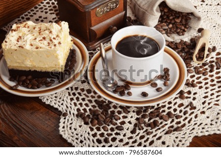 black coffee in a cup with chocolate cake