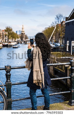 Tourist taking photo at Amsterdam streets