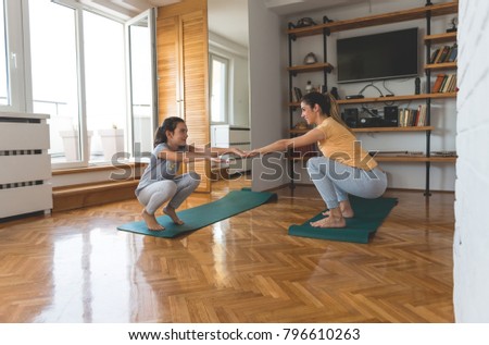 Mother and daughter working out