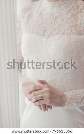 bride looked at the ring while waiting for groom.