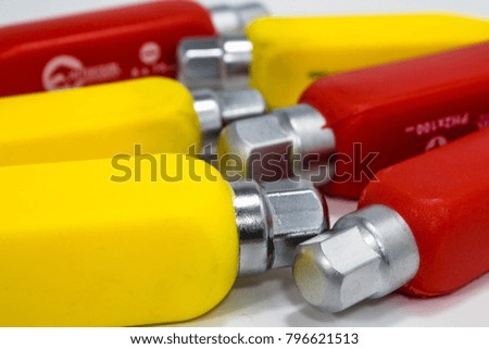 Red and yellow screwdrivers isolate