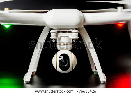 Drone with built-in camera that records to 4k, on white and black background