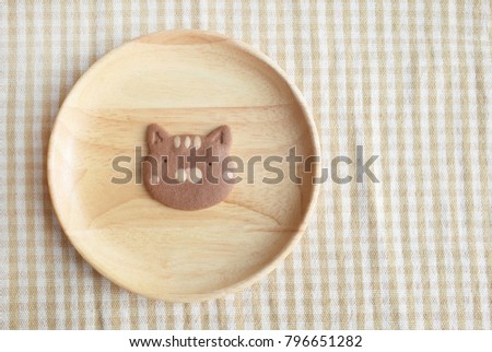 Homemade Chocolate Cookie Cat Face in Wooden Plate 