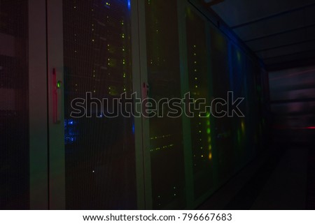 panel modern communication equipment with light from the display at data center in the server room