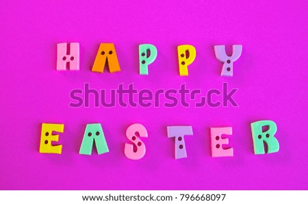 "Happy Easter" colorful in the pink background.
Copy space for ad text,Easter concept.