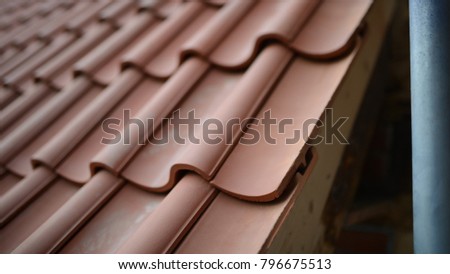 Detail image of the roof tile overlap. construction site-roofing germany 2019 red tiles cross-section 3d.