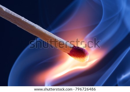 A match take fire and causes smoke emission Royalty-Free Stock Photo #796726486