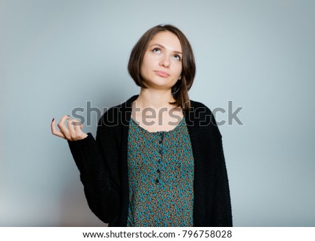 beautiful young woman tells something gesticulating, isolated on background, studio photo