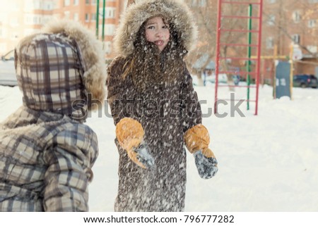 Children playing in a snow