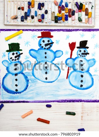 Photo of colorful hand drawing: tree happy snowmans and snowflakes.