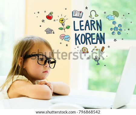 Learn Korean text with little girl using her laptop