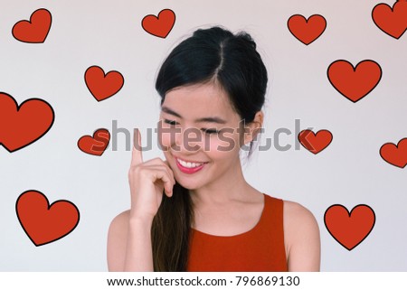 Valentines Day concept- Headshot portrait of long black hair young asian woman wearing red dress making a wish and smiling with red heart illustration doodle icon at the back ground