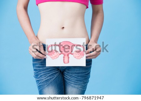 woman with uterus health concept on the blue background
