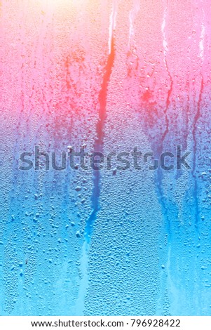 Wet window with condensation on the glass. Natural background with high humidity