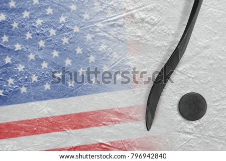 Hockey puck, stick and the image of the American flag on the ice. Concept, hockey