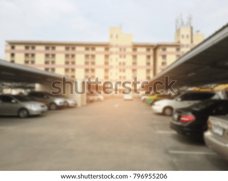 blurred car park background
