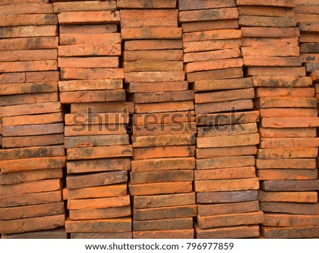 Picture of piles of red old bricks