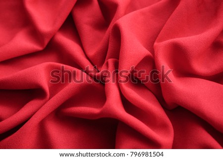 The texture of the pleated fabric. Red georgette fabrics. 